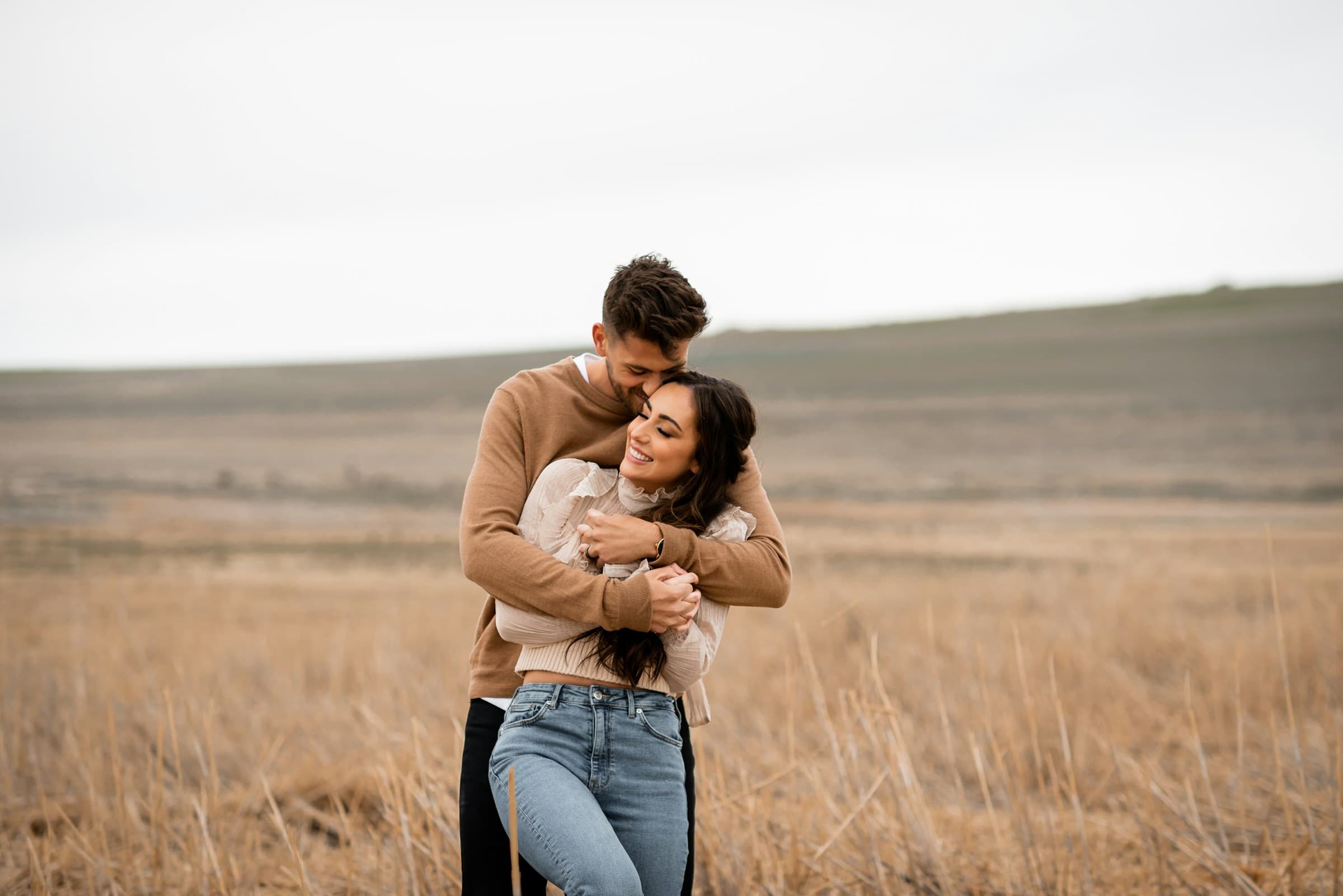 A couple sharing a warm, joyful embrace